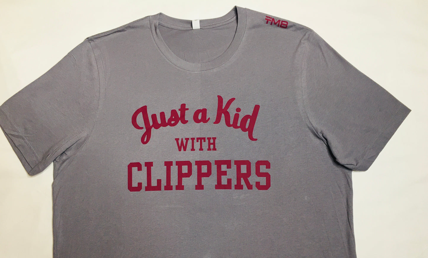 KID WITH CLIPPERS TEE