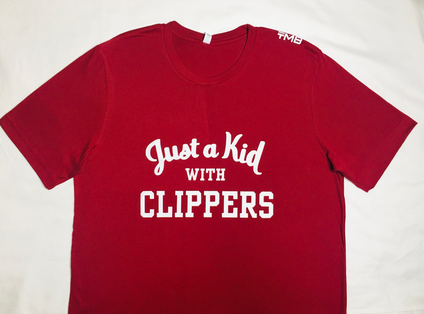 KID WITH CLIPPERS TEE